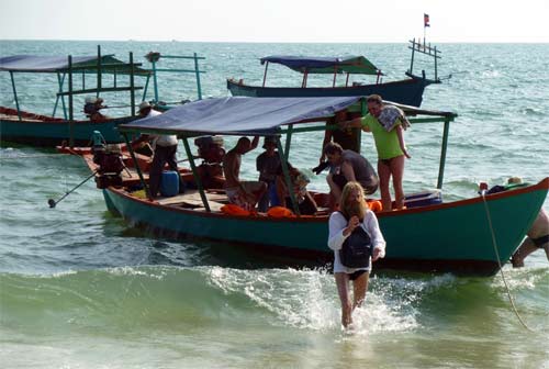 a boat coming back from a deserted island in cambodia